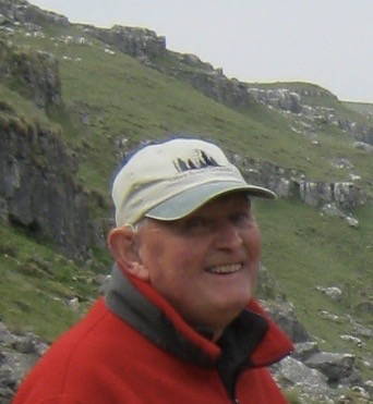 Jon Hodge posing ahead of some hills